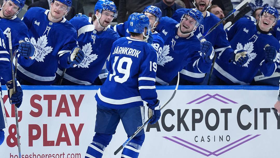 Dec 30, 2025; Toronto, Ontario, CAN; Toronto Maple Leafs center Calle Jarnkrok (19) celebrates at the bench after scoring a goal against the New Jersey Devils during the third period at Scotiabank Arena. Mandatory Credit: Nick Turchiaro-Imagn Images