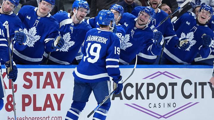 Dec 30, 2025; Toronto, Ontario, CAN; Toronto Maple Leafs center Calle Jarnkrok (19) celebrates at the bench after scoring a goal against the New Jersey Devils during the third period at Scotiabank Arena. Mandatory Credit: Nick Turchiaro-Imagn Images
