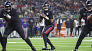 Dec 25, 2024; Houston, Texas, USA; Houston Texans quarterback C.J. Stroud (7) looks for an open receiver during the game against the Baltimore Ravens at NRG Stadium. Mandatory Credit: Troy Taormina-Imagn Images