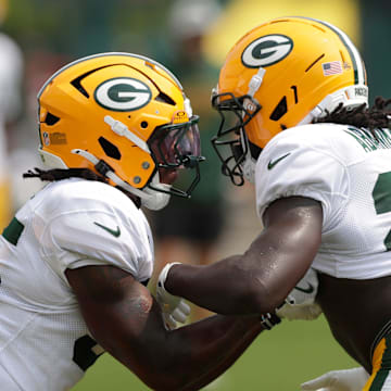 Green Bay Packers running backs Jalen White (35) and Israel Abanikanda (23) participate in drills on Tuesday.