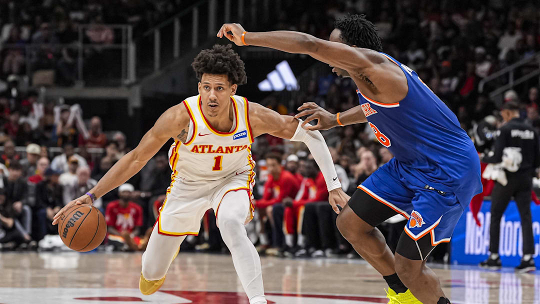 Apr 25, 2026; Atlanta, Georgia, USA; Atlanta Hawks forward Jalen Johnson (1) handles the ball guarded by New York Knicks forward Og Anunoby (8) during the second half during game four of the first round of the 2026 NBA Playoffs at State Farm Arena. Mandatory Credit: Dale Zanine-Imagn Images