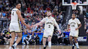 Mar 22, 2025; Providence, RI, USA; Purdue Boilermakers forward Trey Kaufman-Renn (4) and guard Braden Smith (3) react after a play during the second half of a second round men’s NCAA Tournament game against the McNeese State Cowboys at Amica Mutual Pavilion. Mandatory Credit: Gregory Fisher-Imagn Images