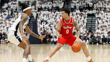 Jan 30, 2025; University Park, Pennsylvania, USA; Ohio State Buckeyes guard John Mobley Jr (0) dribbles the ball as Penn State Nittany Lions guard Nick Kern Jr (3) defends during the first half at Rec Hall. Mandatory Credit: Matthew O'Haren-Imagn Images