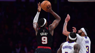 Jan 21, 2024; Los Angeles, California, USA; Portland Trail Blazers forward Jerami Grant (9) shoots against Los Angeles Lakers forward Anthony Davis (3) and forward Jarred Vanderbilt (2) during the second half at Crypto.com Arena. Mandatory Credit: Gary A. Vasquez-USA TODAY Sports