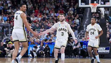 Mar 22, 2025; Providence, RI, USA; Purdue Boilermakers forward Trey Kaufman-Renn (4) and guard Braden Smith (3) react after a play during the second half of a second round men’s NCAA Tournament game against the McNeese State Cowboys at Amica Mutual Pavilion. Mandatory Credit: Gregory Fisher-Imagn Images