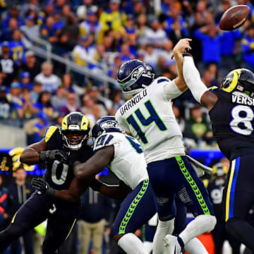 Nov 16, 2025; Inglewood, California, USA; Los Angeles Rams linebacker Jared Verse (8) knocks the ball away from Seattle Seahawks quarterback Sam Darnold (14) for an incompletion during the second half at SoFi Stadium. Mandatory Credit: Gary A. Vasquez-Imagn Images