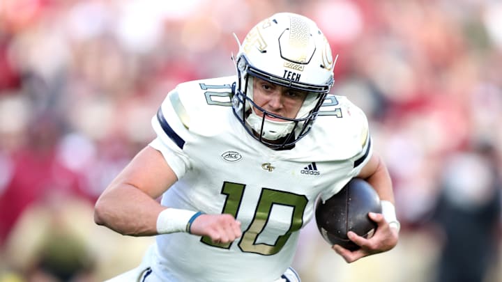 Aug 24, 2024; Dublin, IRL; Georgia Tech quarterback Haynes King of runs with the ball against Florida State at Aviva Stadium. Mandatory Credit: Tom Maher/INPHO via Imagn Images