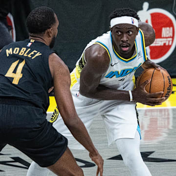 May 9, 2025; Indianapolis, Indiana, USA; Indiana Pacers forward Pascal Siakam (43) holds the ball while Cleveland Cavaliers forward Evan Mobley (4) defends during game three of the second round for the 2025 NBA Playoffs at Gainbridge Fieldhouse. Mandatory Credit: Trevor Ruszkowski-Imagn Images
