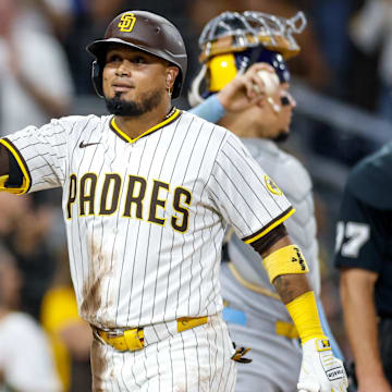 Sep 23, 2025; San Diego, California, USA; San Diego Padres designated hitter Luis Arraez (4) celebrates with second baseman Mason McCoy (18) after hitting a two-run home run during the second inning against the Milwaukee Brewers at Petco Park. Mandatory Credit: David Frerker-Imagn Images