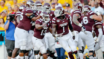 Sep 20, 2014; Baton Rouge, LA, USA; Mississippi State Bulldogs wide receiver De'Runnya Wilson (1) celebrates with teammates after scoring a touchdown against the LSU Tigers during the first quarter of a game at Tiger Stadium. Mandatory Credit: Derick E. Hingle-Imagn Images