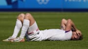 Aug 2, 2024; Paris, France; United States forward Duncan McGuire (13) reacts after losing to Morocco in a men's football quarterfinal during the Paris 2024 Olympic Summer Games at Parc des Princes. Mandatory Credit: Andrew P. Scott-USA TODAY Sports
