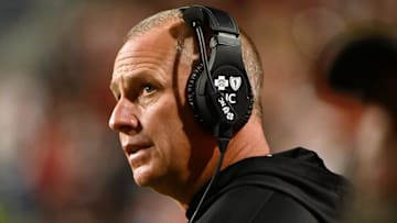 Nov 4, 2023; Raleigh, North Carolina, USA; North Carolina State Wolfpack head coach Dave Doeren looks on during the second half against the Miami Hurricanes at Carter-Finley Stadium.  Mandatory Credit: Rob Kinnan-Imagn Images