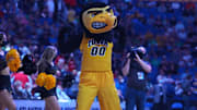 Mar 17, 2022; Buffalo, NY, USA; The Iowa Hawkeyes cheerleaders and mascot perform before the first half against the Richmond Spiders during the first round of the 2022 NCAA Tournament at KeyBank Center. Mandatory Credit: Gregory Fisher-Imagn Images