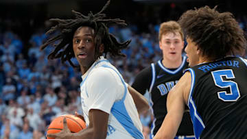 Mar 8, 2025; Chapel Hill, North Carolina, USA;  North Carolina Tar Heels guard Ian Jackson (11) with the ball as Duke Blue Devils guard Tyrese Proctor (5) defends in the second half at Dean E. Smith Center. Mandatory Credit: Bob Donnan-Imagn Images