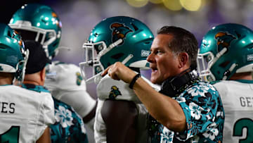Dec 23, 2023; Honolulu, HI, USA; Coastal Carolina Chanticleers head coach Tim Beck talks to his players during the first quarter of the Easypost Hawaii Bowl against the San Jose State Spartans at Clarence T.C. Ching Athletics Complex. Mandatory Credit: Steven Erler-Imagn Images