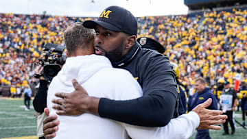 Michigan head coach Sherrone Moore hugs Texas head coach Steve Sarkisian after 31-12 loss at Michigan Stadium in Ann Arbor on Saturday, September 7, 2024.