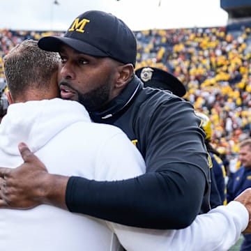 Michigan head coach Sherrone Moore hugs Texas head coach Steve Sarkisian after 31-12 loss at Michigan Stadium in Ann Arbor on Saturday, September 7, 2024.