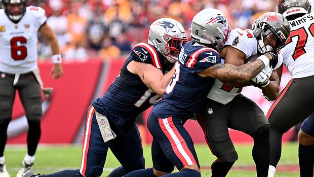 Nov 9, 2025; Tampa, Florida, USA; Tampa Bay Buccaneers running back Sean Tucker (44) is tackled by New England Patriots corne