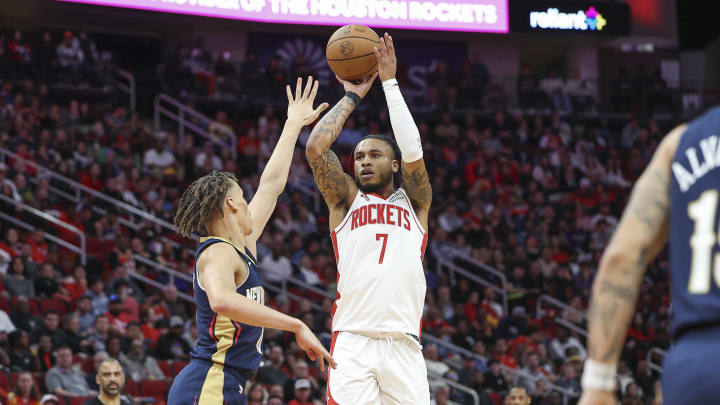 Jan 31, 2024; Houston, Texas, USA; Houston Rockets forward Cam Whitmore (7) shoots the ball as New Orleans Pelicans guard Dyson Daniels (11) defends during the third quarter at Toyota Center. Mandatory Credit: Troy Taormina-USA TODAY Sports