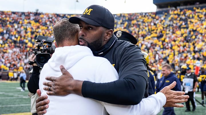 Michigan head coach Sherrone Moore hugs Texas head coach Steve Sarkisian after 31-12 loss at Michigan Stadium in Ann Arbor on Saturday, September 7, 2024.