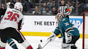 Mar 7, 2020; San Jose, California, USA; San Jose Sharks goaltender Aaron Dell (30) blocks a shot by Ottawa Senators forward Colin White (36) during the first period at SAP Center at San Jose. Mandatory Credit: D. Ross Cameron-Imagn Images
