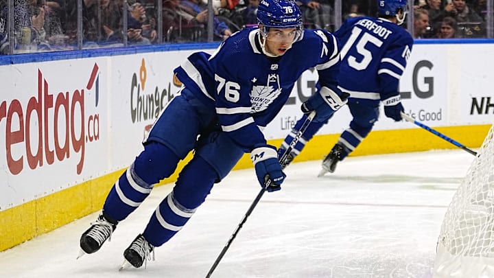Sep 24, 2022; Toronto, Ontario, CAN; Toronto Maple Leafs defenseman William Villeneuve (76) carries the puck against the Ottawa Senators during the third period at Scotiabank Arena. Mandatory Credit: John E. Sokolowski-Imagn Images
