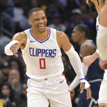Apr 4, 2024; Los Angeles, California, USA; Los Angeles Clippers guard Russell Westbrook (0) celebrates with guard Amir Coffey (7) in the second half against the Denver Nuggets at Crypto.com Arena.