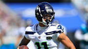 Seattle Seahawks wide receiver Jaxon Smith-Njigba (11) rushes for yards during the second quarter of an NFL football matchup, Sunday, Oct. 12, 2025, at EverBank Stadium in Jacksonville, Fla. The Seahawks defeated the Jaguars 20-12.