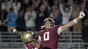 Nov 1, 2025; Tallahassee, Florida, USA; Florida State Seminoles quarterback Tommy Castellanos (1) celebrates a touchdown with wide receiver Duce Robinson (0) during the second half against the Wake Forest Demon Deacons at Doak S. Campbell Stadium. Mandatory Credit: Melina Myers-Imagn Images
