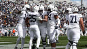 Members of the White Team on the Penn State Nittany Lions roster celebrate a touchdown during the 2024 Blue-White Game at Beaver Stadium. 