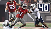 Sep 4, 2021; Pullman, Washington, USA; Washington State Cougars wide receiver Travel Harris (1) is tracked by Utah State Aggies linebacker Cash Gilliam, left and Utah State Aggies linebacker AJ Vongphachanh in the first half at Gesa Field at Martin Stadium. Mandatory Credit: James Snook-Imagn Images