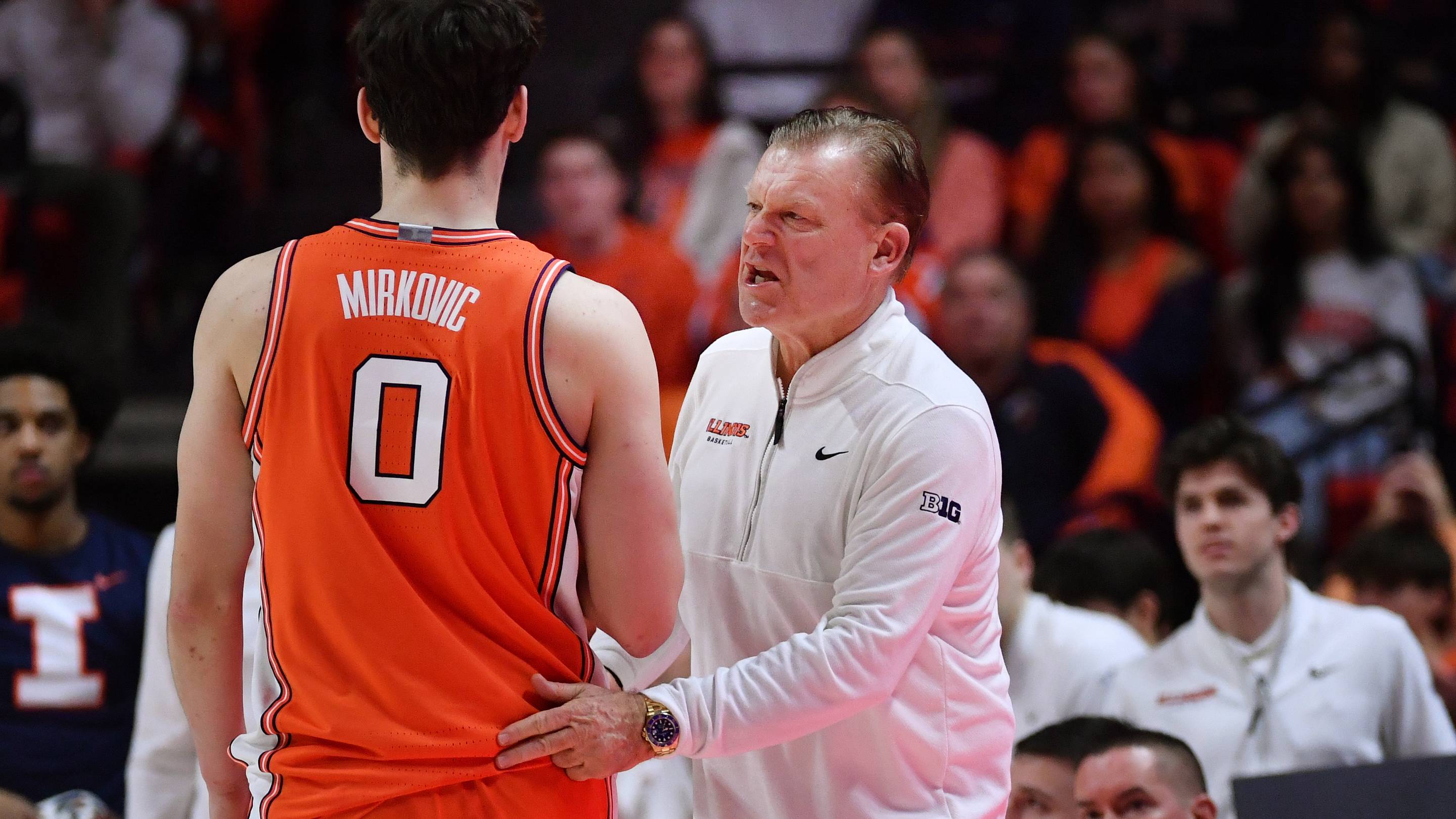Feb 4, 2026; Champaign, Illinois, USA; Illinois Fighting Illini head coach Brad Underwood talks to forward David Mirkovic (0) during the first half against the Northwestern Wildcats at State Farm Center. Mandatory Credit: Ron Johnson-Imagn Images