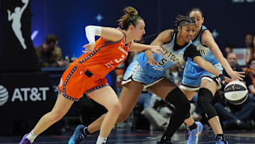 Jun 15, 2025; Uncasville, Connecticut, USA; Chicago Sky forward Angel Reese (5) and Connecticut Sun guard Marina Mabrey (3) work for the ball in the first half at Mohegan Sun Arena. Mandatory Credit: David Butler II-Imagn Images