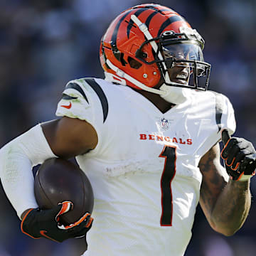 Cincinnati Bengals wide receiver Ja'Marr Chase (1) breaks tackles as he takes a reception 82 yards for a touchdown in the third quarter of the NFL Week 7 game between the Baltimore Ravens and the Cincinnati Bengals at M&T Bank Stadium in Baltimore on Sunday, Oct. 24, 2021. The Bengals moved into the top of the AFC North with a 41-17 win over the Ravens.