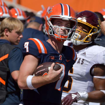 Sep 14, 2024; Champaign, Illinois, USA;  Illinois Fighting Illini quarterback Luke Altmyer (9) runs to the sidelines against the Central Michigan Chippewas during the second half at Memorial Stadium. Mandatory Credit: Ron Johnson-Imagn Images