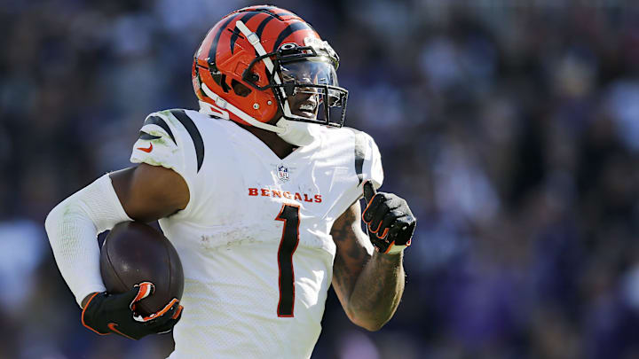 Cincinnati Bengals wide receiver Ja'Marr Chase (1) breaks tackles as he takes a reception 82 yards for a touchdown in the third quarter of the NFL Week 7 game between the Baltimore Ravens and the Cincinnati Bengals at M&T Bank Stadium in Baltimore on Sunday, Oct. 24, 2021. The Bengals moved into the top of the AFC North with a 41-17 win over the Ravens.