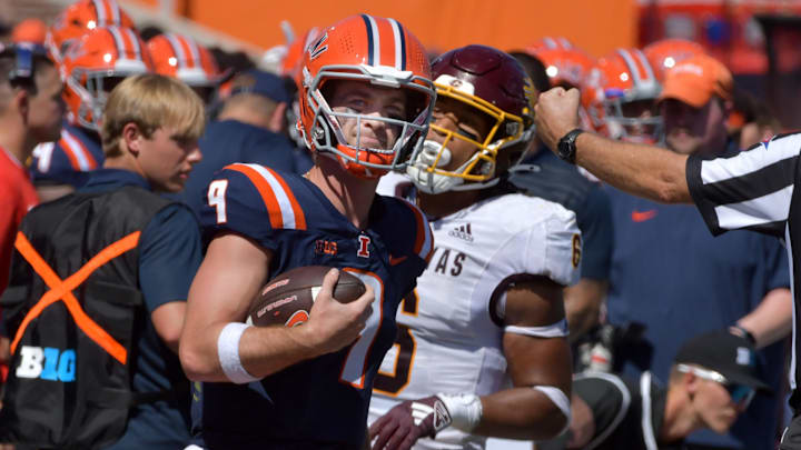 Sep 14, 2024; Champaign, Illinois, USA;  Illinois Fighting Illini quarterback Luke Altmyer (9) runs to the sidelines against the Central Michigan Chippewas during the second half at Memorial Stadium. Mandatory Credit: Ron Johnson-Imagn Images