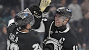 Mar 30, 2025; Los Angeles, California, USA;  Los Angeles Kings center Anze Kopitar (11) and left wing Kevin Fiala (22) high five after defeating the San Jose Sharks at Crypto.com Arena. Mandatory Credit: Jayne Kamin-Oncea-Imagn Images
