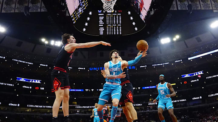 Jan 17, 2025; Chicago, Illinois, USA; Chicago Bulls guard Josh Giddey (3) defends Charlotte Hornets guard LaMelo Ball (1) during the first half at United Center. Mandatory Credit: David Banks-Imagn Images