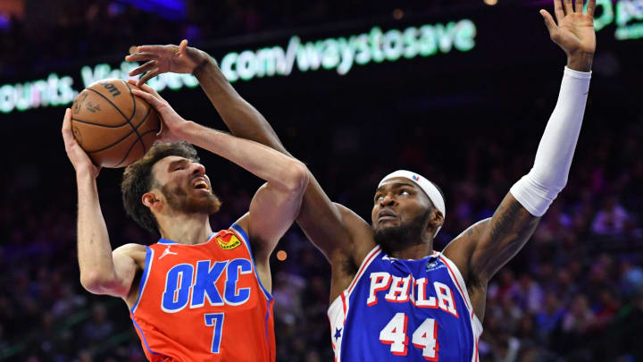 Apr 2, 2024; Philadelphia, Pennsylvania, USA; Oklahoma City Thunder forward Chet Holmgren (7) drives to the basket against Philadelphia 76ers forward Paul Reed (44) during the fourth quarter at Wells Fargo Center. Mandatory Credit: Eric Hartline-USA TODAY Sports