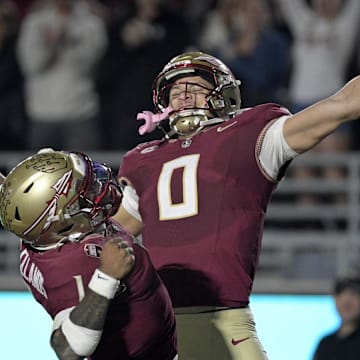Nov 1, 2025; Tallahassee, Florida, USA; Florida State Seminoles quarterback Tommy Castellanos (1) celebrates a touchdown with wide receiver Duce Robinson (0) during the second half against the Wake Forest Demon Deacons at Doak S. Campbell Stadium. Mandatory Credit: Melina Myers-Imagn Images