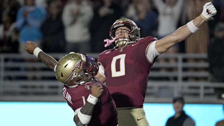 Nov 1, 2025; Tallahassee, Florida, USA; Florida State Seminoles quarterback Tommy Castellanos (1) celebrates a touchdown with wide receiver Duce Robinson (0) during the second half against the Wake Forest Demon Deacons at Doak S. Campbell Stadium. Mandatory Credit: Melina Myers-Imagn Images Nov 1, 2025; Tallahassee, Florida, USA; Florida State Seminoles quarterback Tommy Castellanos (1) celebrates a touchdown with wide receiver Duce Robinson (0) during the second half against the Wake Forest Demon Deacons at Doak S. Campbell Stadium. Mandatory Credit: Melina Myers-Imagn Images