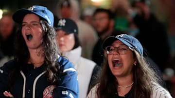 Pearl Herber (right) and Chana Rap, both 22, of Brooklyn root for the Yankees, at the North Oculus Plaza, at the World Trade Center, Monday, October 28, 2024.