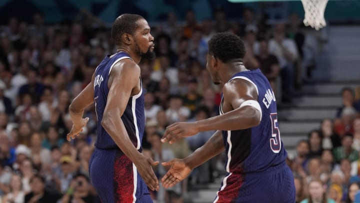 Aug 3, 2024; Villeneuve-d'Ascq, France; United States guard Kevin Durant (7) celebrates with guard Anthony Edwards (5) in the second quarter against Puerto Rico during the Paris 2024 Olympic Summer Games at Stade Pierre-Mauroy. Mandatory Credit: John David Mercer-USA TODAY Sports