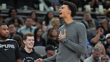 Mar 4, 2025; San Antonio, Texas, USA;  San Antonio Spurs guard Blake Wesley (14) and San Antonio Spurs center Victor Wembanyama (1) celebrate on the sideline in the second half against the Brooklyn Nets at Frost Bank Center. Mandatory Credit: Daniel Dunn-Imagn Images