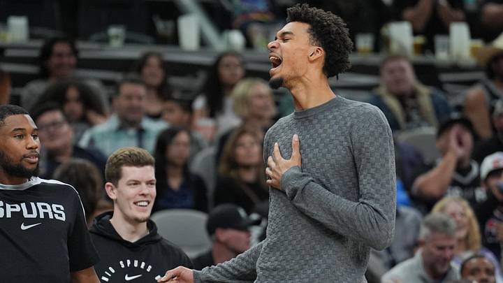 Mar 4, 2025; San Antonio, Texas, USA;  San Antonio Spurs guard Blake Wesley (14) and San Antonio Spurs center Victor Wembanyama (1) celebrate on the sideline in the second half against the Brooklyn Nets at Frost Bank Center. Mandatory Credit: Daniel Dunn-Imagn Images