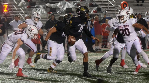 Lake Travis pursues scrambling San Antonio Brennan QB Ashton Dubose during a playoff game in New Braunfels.