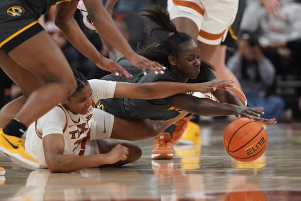 Madison Booker fights for a loose ball
