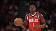 Nov 3, 2025; Houston, Texas, USA;  Houston Rockets guard Amen Thompson (1) dribbles against the Dallas Mavericks in the first quarter at Toyota Center. Mandatory Credit: Thomas Shea-Imagn Images