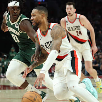 Feb 6, 2023; Portland, Oregon, USA; Portland Trail Blazers guard Damian Lillard (0) drives the lane against Milwaukee Bucks guard Jrue Holiday (21) in the second half at Moda Center. Mandatory Credit: Jaime Valdez-Imagn Images